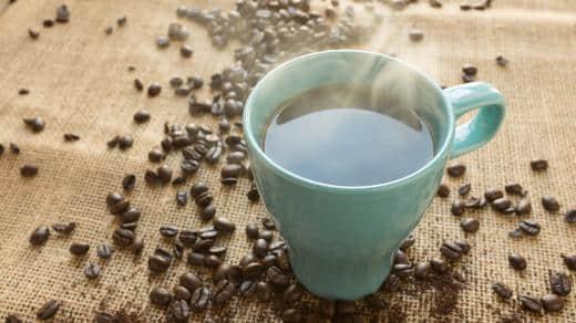 Coffee beans and a cup of coffee Coffee beans and a cup of coffee