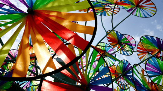 rainbow colors on pinwheels in the sun rainbow colors on pinwheels in the sun