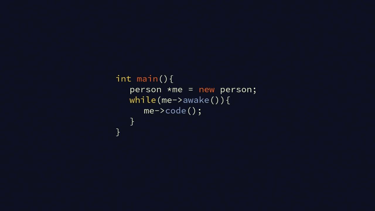 Person drinking a hot drink at the computer